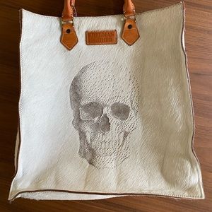 Authentic Hair Hide Tote with laser etched skull.